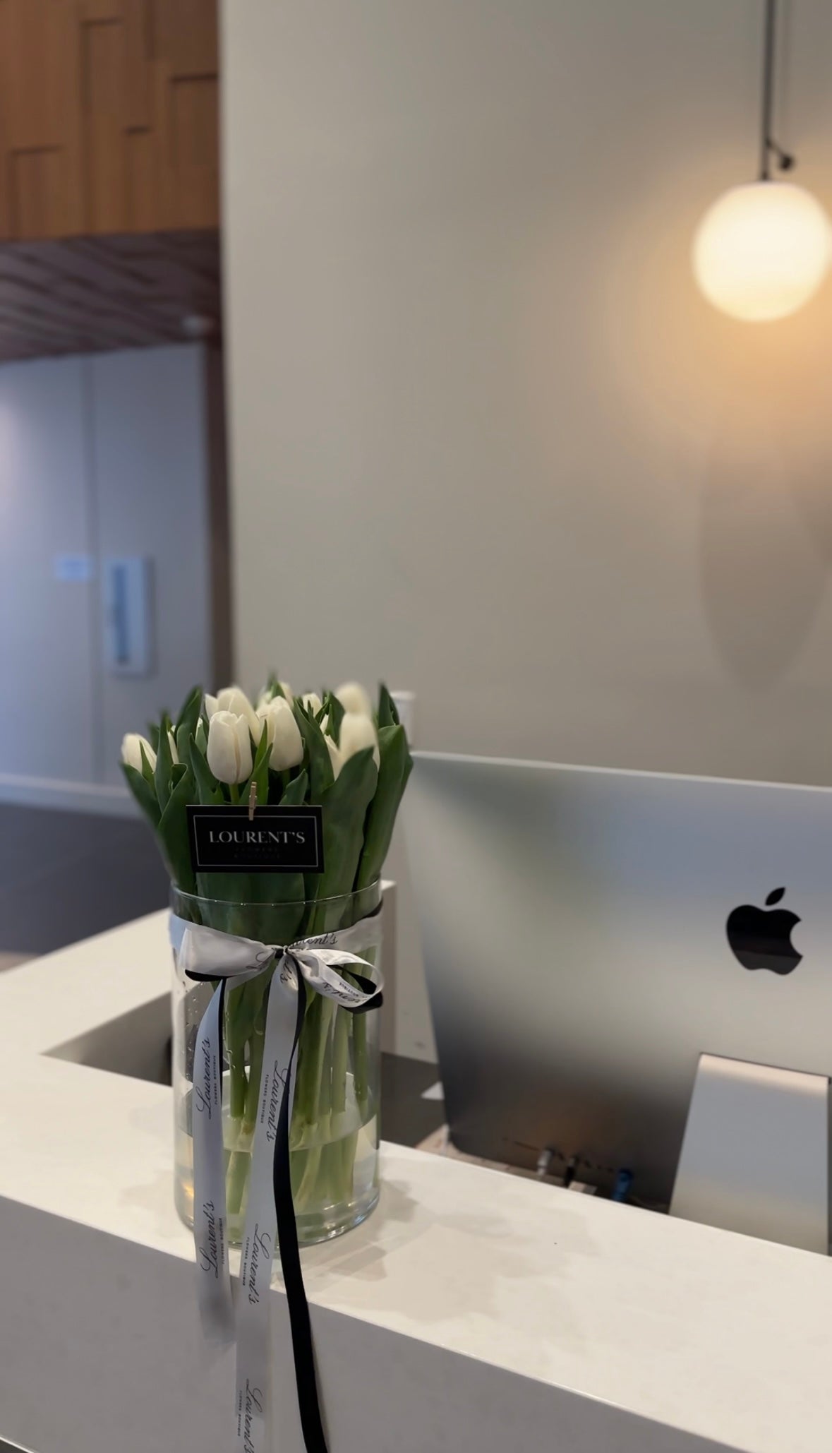 25 White Tulips in a vase