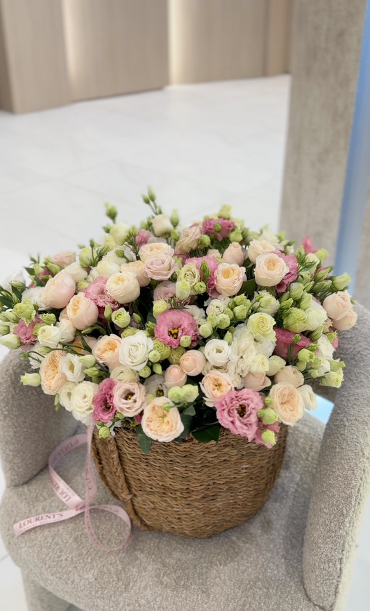 Basket with lisianthus and garden roses